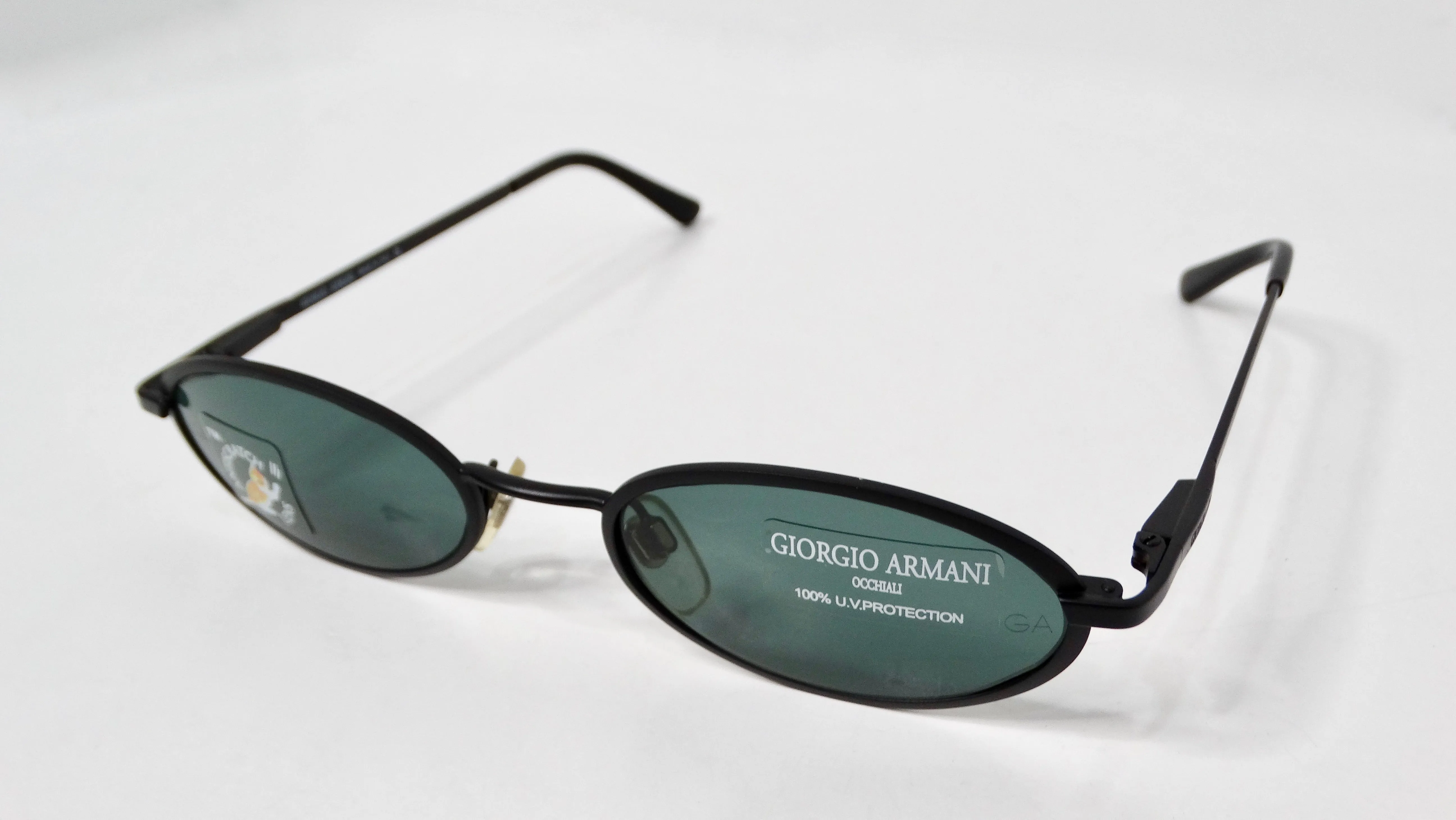 1990s Giorgio Armani Blue Tinted Black Metal Skinny Oval Sunglasses