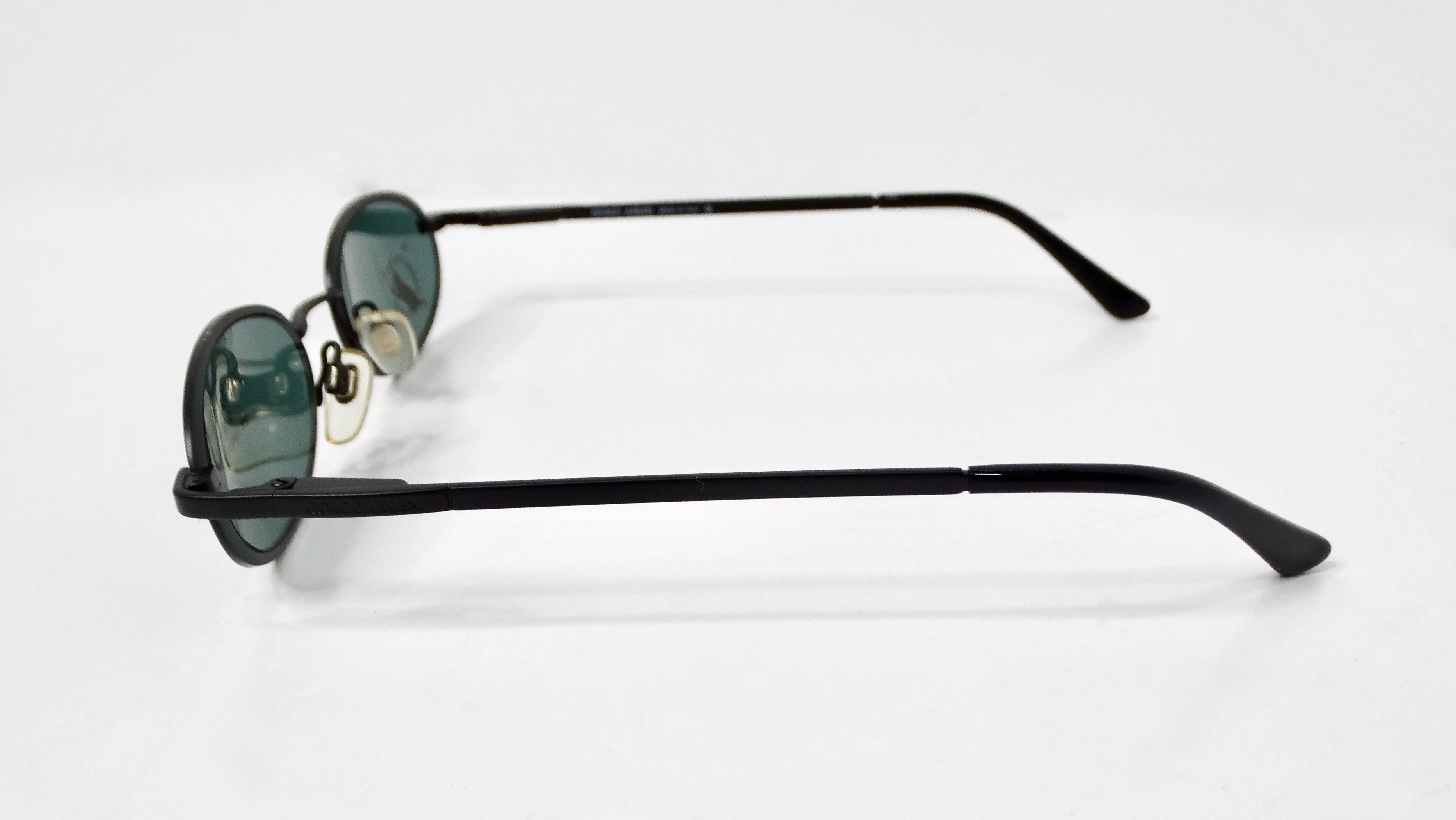 1990s Giorgio Armani Blue Tinted Black Metal Skinny Oval Sunglasses
